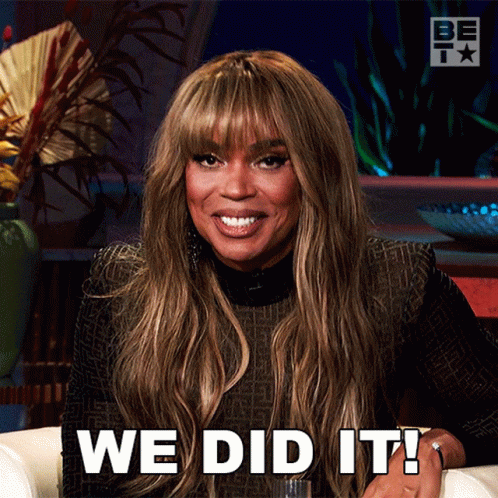 A Woman Sitting On A Couch With The Words We Did It Written On Her Face GIF