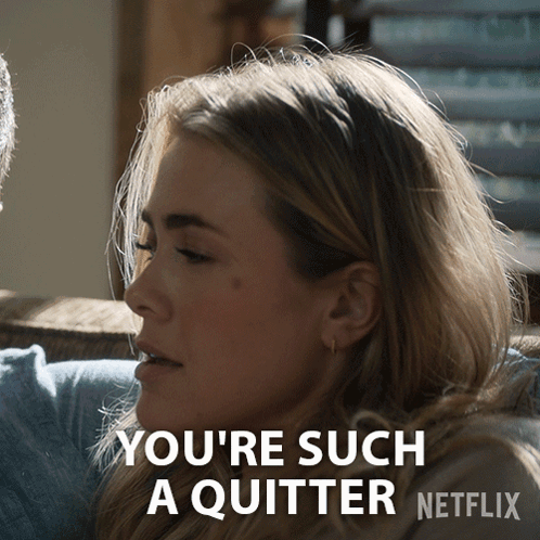 A Woman Sitting On A Couch With The Words You 'Re Such A Quitter GIF