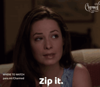 A Woman Sitting On A Couch With The Words Zip It On Her Chest GIF
