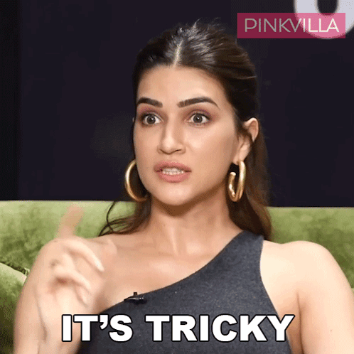 A Woman Sitting On A Green Couch With The Words It 'S Tricky On Her Face GIF