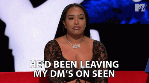 A Woman Sitting On A Red Couch With The Words He 'D Been Leaving My Dm 'S On Seen Behind Her GIF