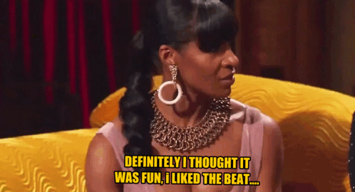 A Woman Sitting On A Yellow Couch Says " Definitely I Thought It Was Fun I Liked The Beat " GIF