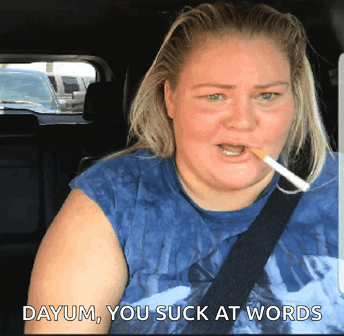 A Woman Smoking A Cigarette With The Words Dayum You Suck At Words Behind Her GIF