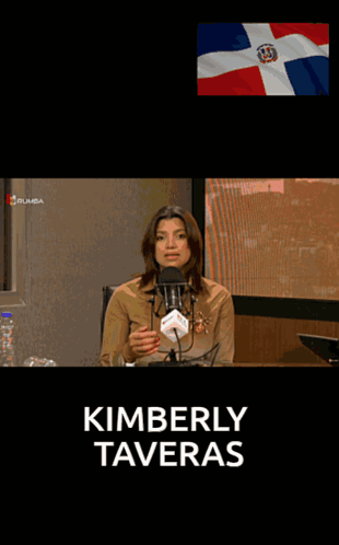 A Woman Speaking Into A Microphone With The Name Kimberly Tavera On The Top GIF