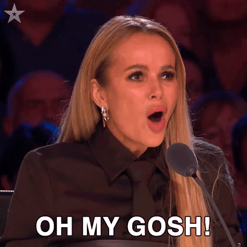 a woman speaking into a microphone with the words oh my gosh