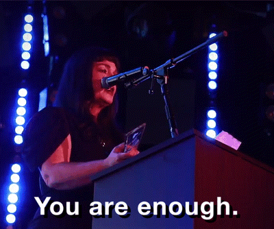 A Woman Speaking Into A Microphone With The Words You Are Enough GIF