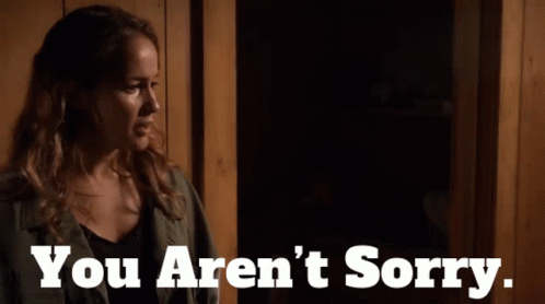 Woman Standing In Dark Room With You Aren't Sorry Text GIF