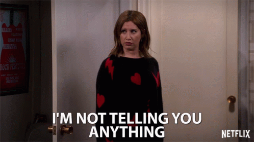 A Woman Standing In Front Of A Door That Says I 'M Not Telling You Anything By Netflix GIF