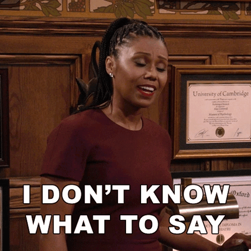 A Woman Standing In Front Of A Framed Diploma From The University Of Cambridge Says " I Don 'T Know What To Say " GIF