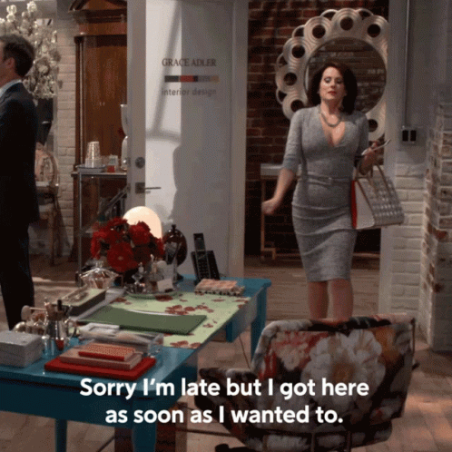 Woman Standing In Front Of Grace Adler Interior Design GIF