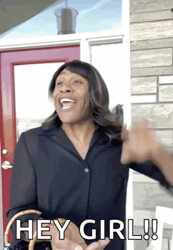 A Woman Standing In Front Of A Red Door Says " Hey Girl " GIF