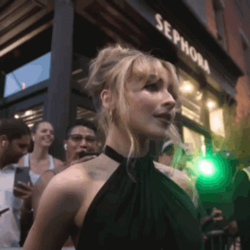 A Woman Standing In Front Of A Sephora Store GIF