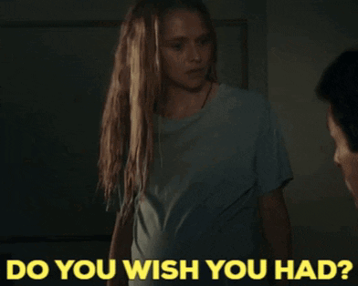 A Woman Standing Next To A Man With The Words " Do You Wish You Had " Written Below Her GIF