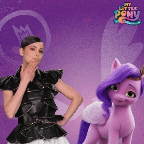 A Woman Standing Next To A Purple Pony That Says My Little Pony On It GIF