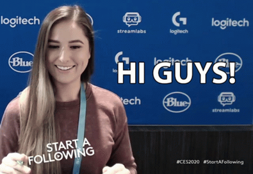 A Woman Stands In Front Of A Blue Background That Says Logitech And Blue GIF