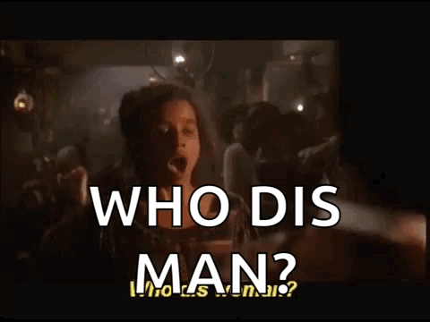 A Woman Stands In Front Of A Crowd And Says Who Dis Man ? GIF
