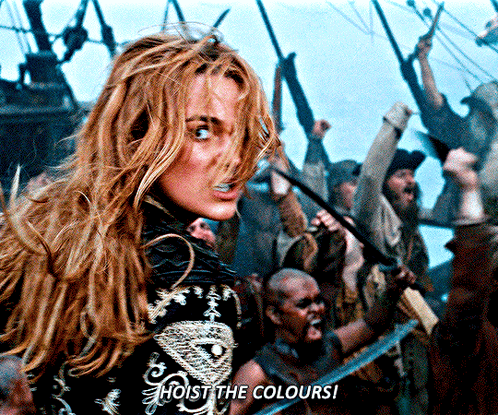 A Woman Stands In Front Of A Crowd With The Words Hoist The Colours GIF
