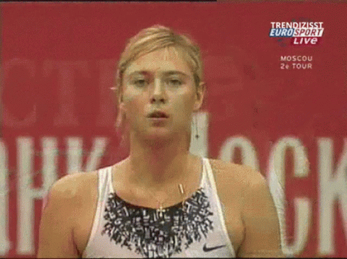 A Woman Stands In Front Of A Eurosport Live Sign GIF