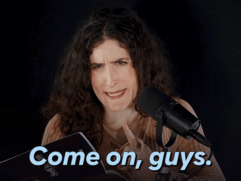A Woman Stands In Front Of A Microphone With The Words Come On Guys Above Her GIF