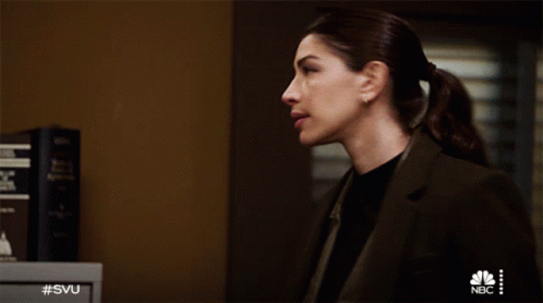 A Woman Stands In Front Of A Nbc Safe GIF