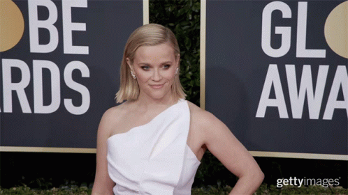 A Woman Stands In Front Of A Sign That Says Be Rds On It GIF