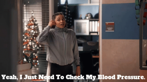 A Woman Stands In Front Of A Sign That Says Captains Office GIF
