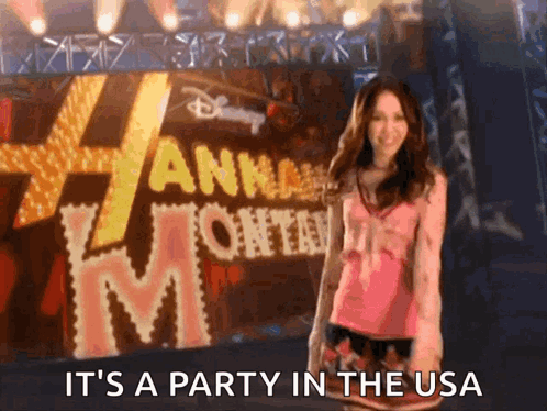 A Woman Stands In Front Of A Sign That Says It 'S A Party In The Usa GIF