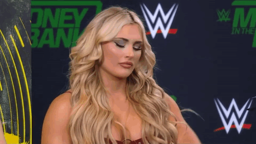 A Woman Stands In Front Of A Sign That Says ' Oney Bank ' GIF