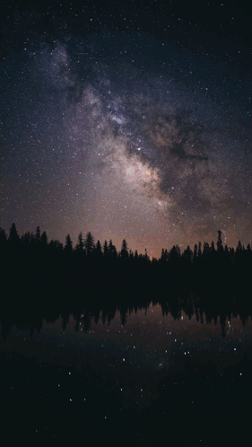 A Woman Stands In Front Of A Starry Night Sky With The Name Oea Written On The Bottom GIF