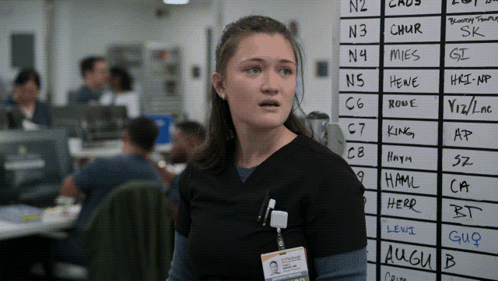 A Woman Stands In Front Of A White Board With The Letters N3 And Chur Written On It GIF
