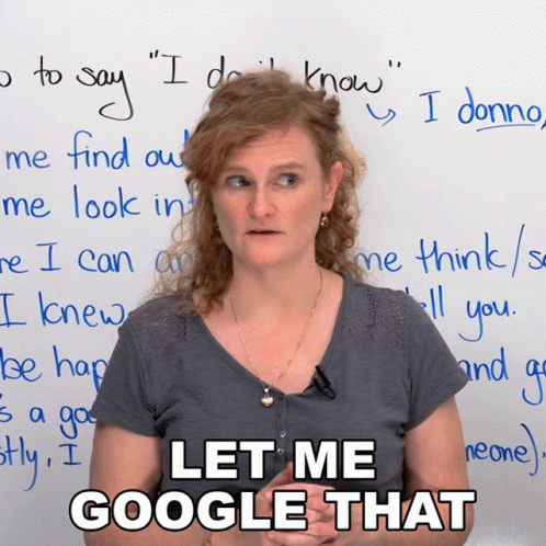 A Woman Stands In Front Of A White Board With The Words Let Me Google That Written On It GIF
