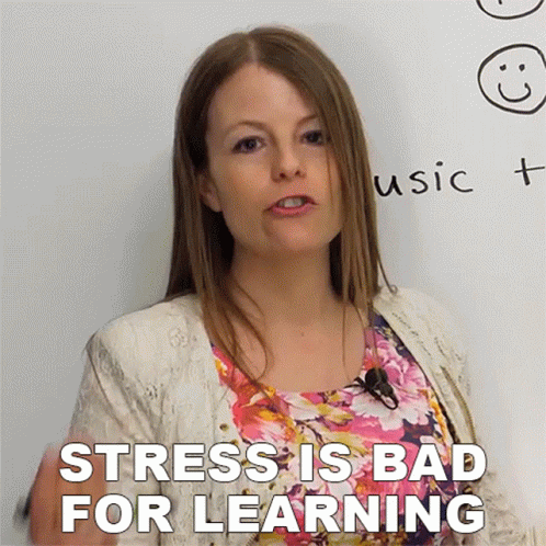 A Woman Stands In Front Of A White Board With The Words " Stress Is Bad For Learning " GIF