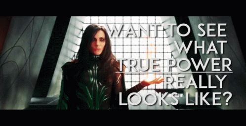 A Woman Stands In Front Of A Window With The Words Want To See What True Power Really Looks Like GIF