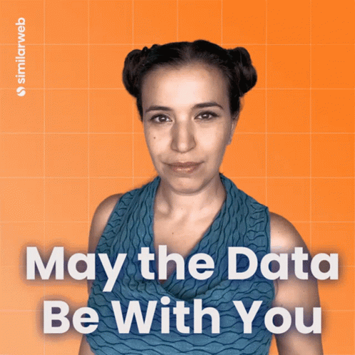 A Woman Stands In Front Of An Orange Background With The Words May The Data Be With You On It GIF