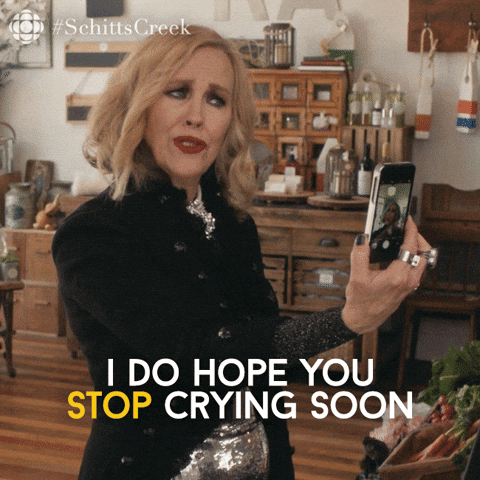 A Woman Taking A Picture Of Herself With The Words I Do Hope You Stop Crying Soon Below Her GIF