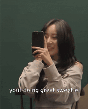 A Woman Taking A Picture Of Herself With The Words Your Doing Great Sweetie Written Below Her GIF