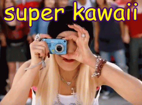 A Woman Taking A Picture With The Words Super Kawaii Written Above Her GIF