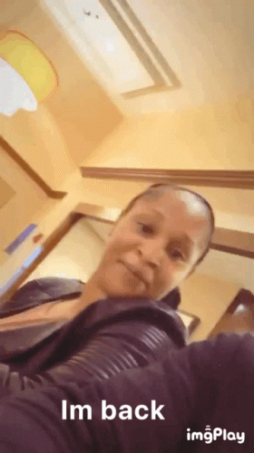 A Woman Taking A Selfie With The Words Im Back On The Bottom GIF