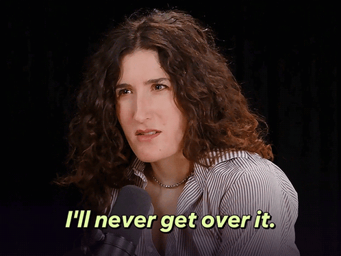 A Woman Talking Into A Microphone With The Words " I 'Ll Never Get Over It " Above Her GIF