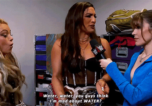 A Woman Talking Into A Microphone With The Words Water Water You Guys Think I 'M Mad About Water Written Below Her GIF