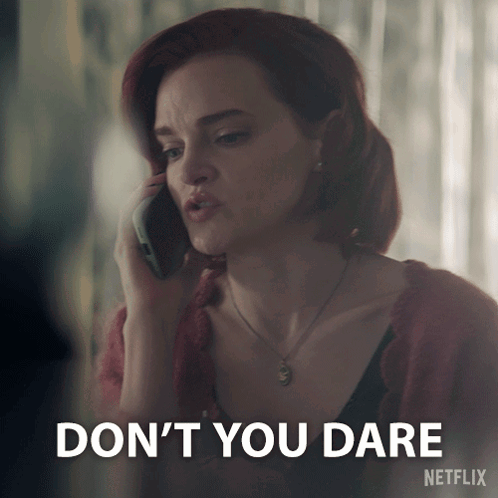 A Woman Talking On A Cell Phone With A Netflix Logo Behind Her GIF