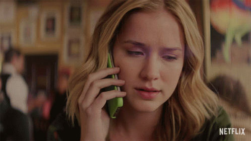 A Woman Talking On A Cell Phone With Netflix Written On The Bottom GIF