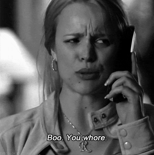 A Woman Talking On A Cell Phone With The Words Boo You Whore Written Below Her GIF