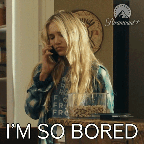 A Woman Talking On A Cell Phone With The Words I 'M So Bored Behind Her GIF