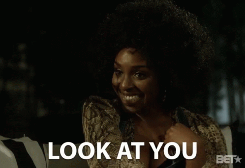 A Woman Talking On A Cell Phone With The Words Look At You Above Her GIF