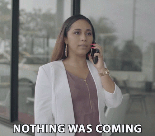 A Woman Talking On A Cell Phone With The Words Nothing Was Coming Behind Her GIF