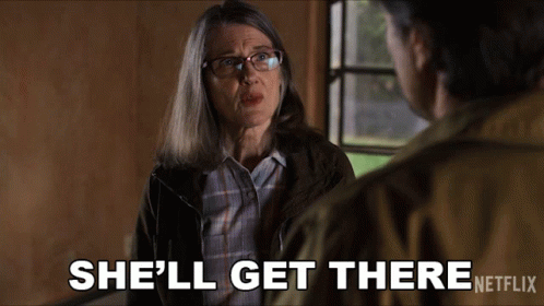 A Woman Talking To A Man With The Words She 'Ll Get There Netflix At The Bottom GIF