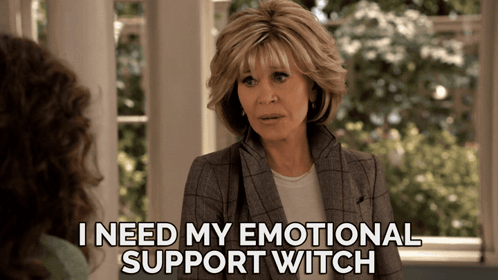 A Woman Talking To Another Woman With The Words I Need My Emotional Support Witch Below Her GIF