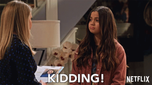 A Woman Talking To Another Woman With The Words Kidding Written On The Bottom GIF