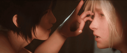A Woman Touches Another Woman 'S Nose With Her Finger GIF